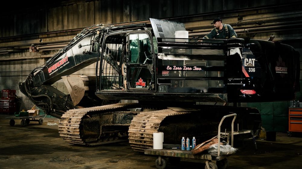 Tracked excavator in for service inside the Mach 6 Edmonton facility
