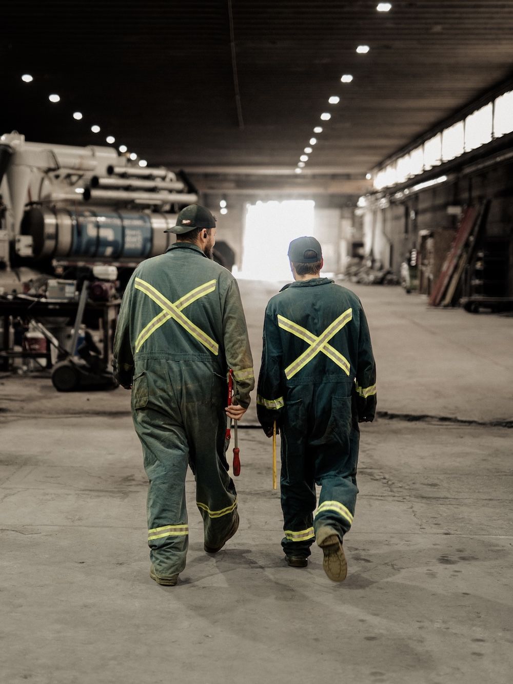 Mach 6 technicians walking the shop floor between service bays