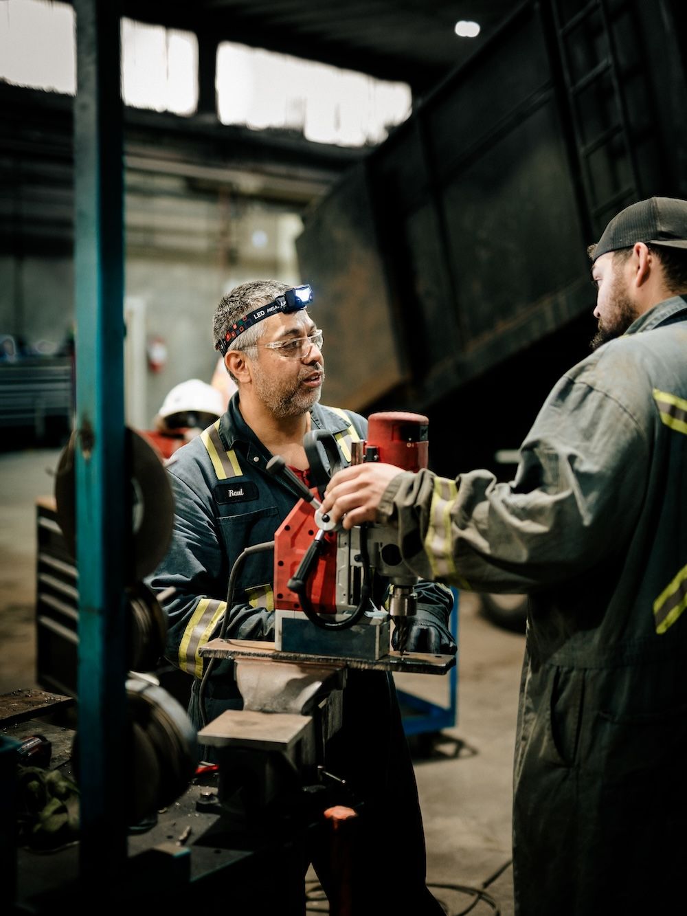 Mach 6 technician performing scheduled maintenance on a lifted unit